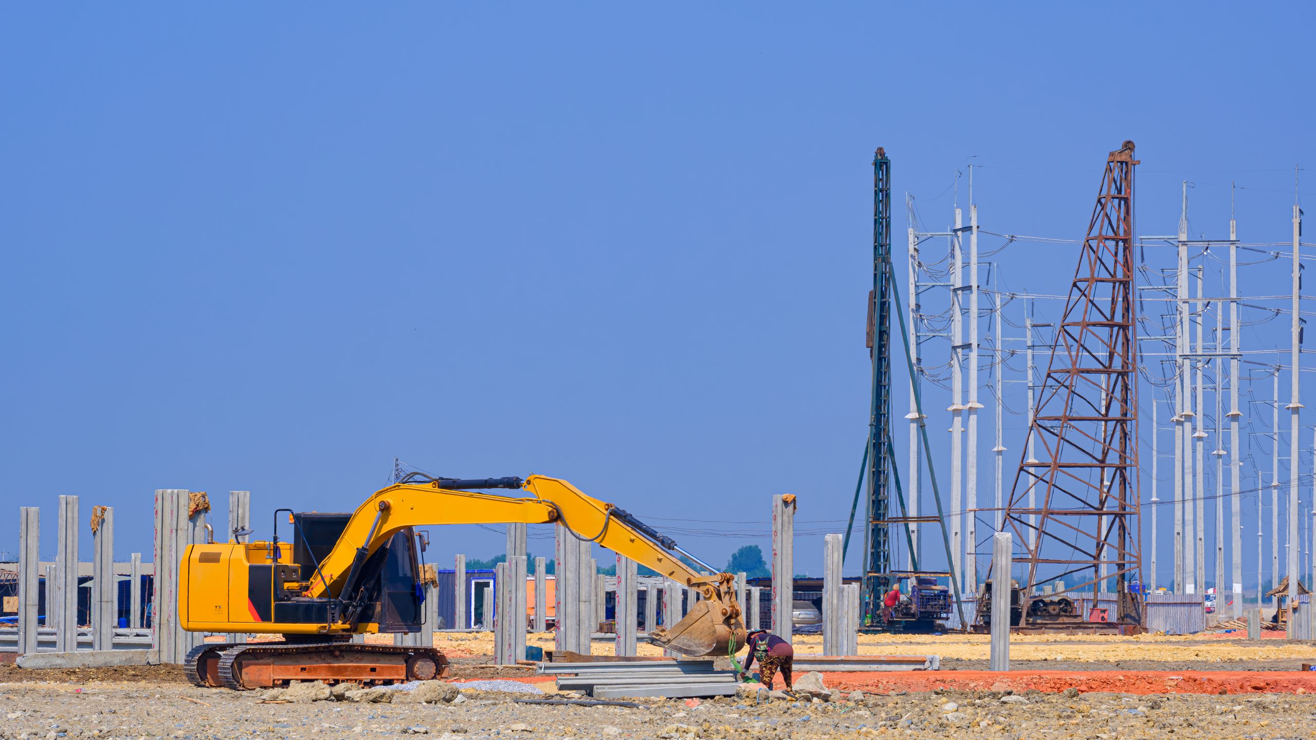 excavator-with-pile-drivers-are-installing-precast-2026-03-09-01-53-17-utc