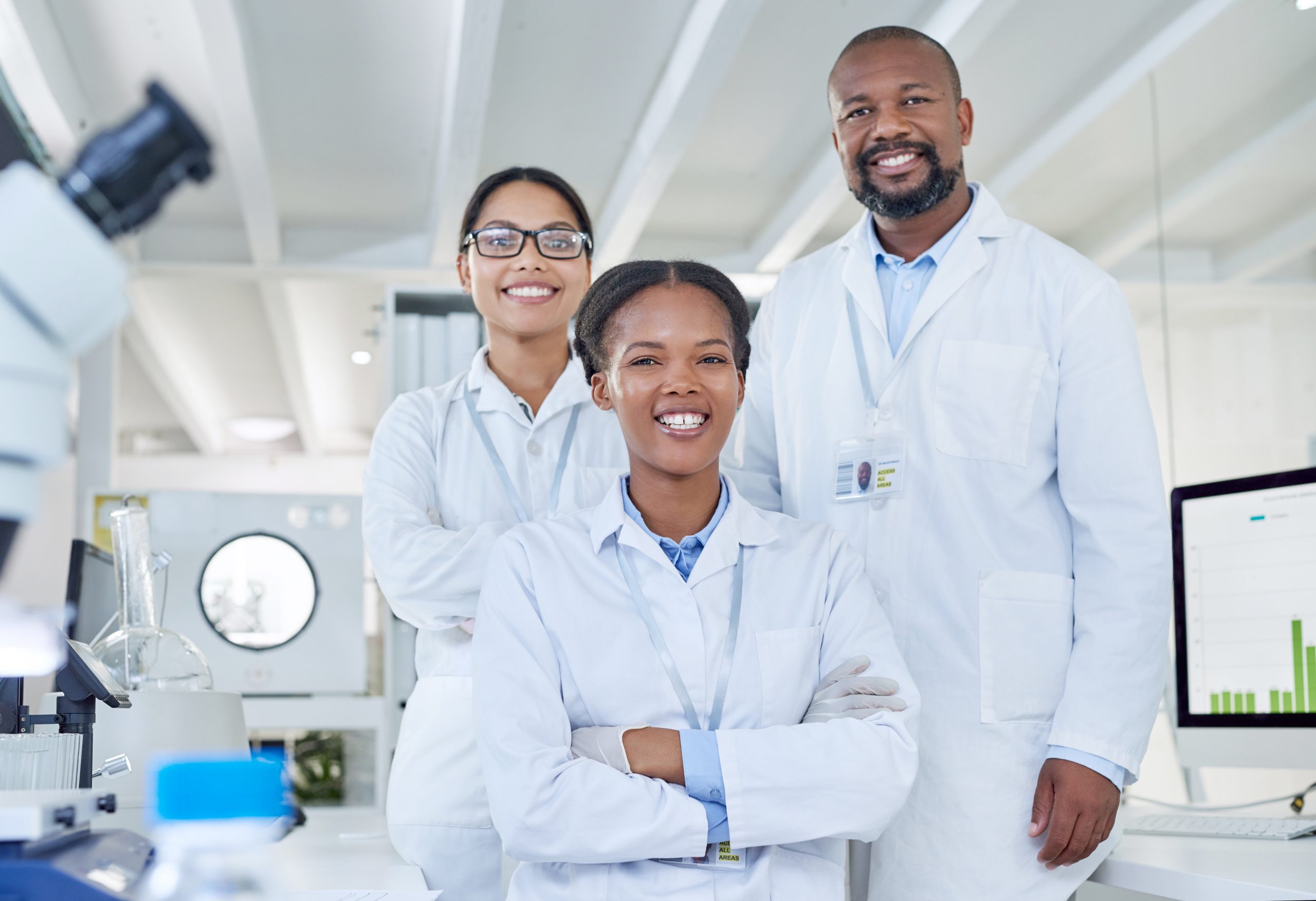 Science, portrait or team in laboratory with smile, about us or experiment in vaccine development. Collaboration, people or scientist with pride, group study or medical research in clinical trial.